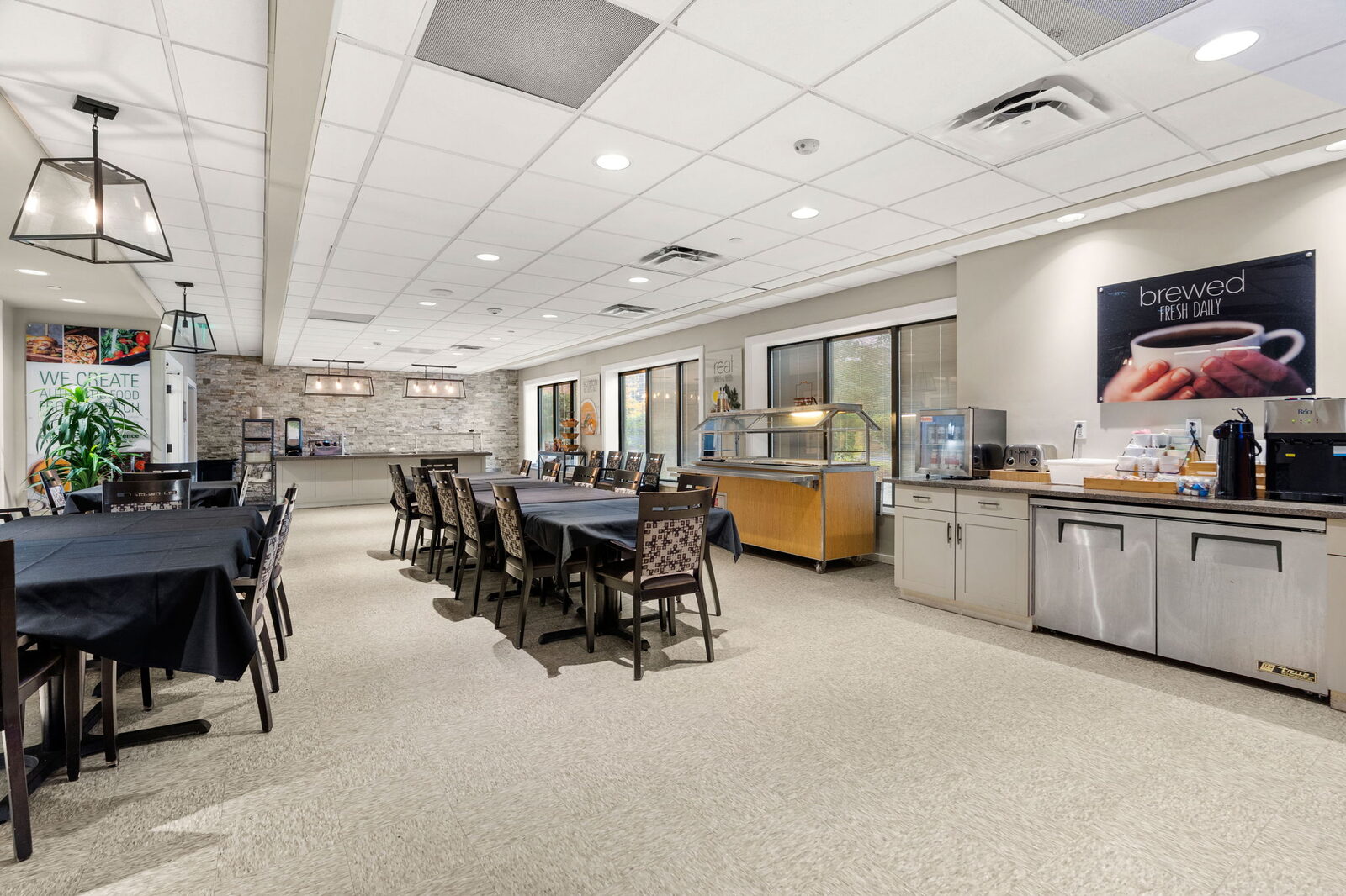 Dining room with tables, a buffet counter and a coffee station